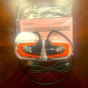 BRAND NEW SONY HEADPHONES WITH CHARGING CORD